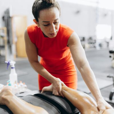 A woman is getting a massage on her leg