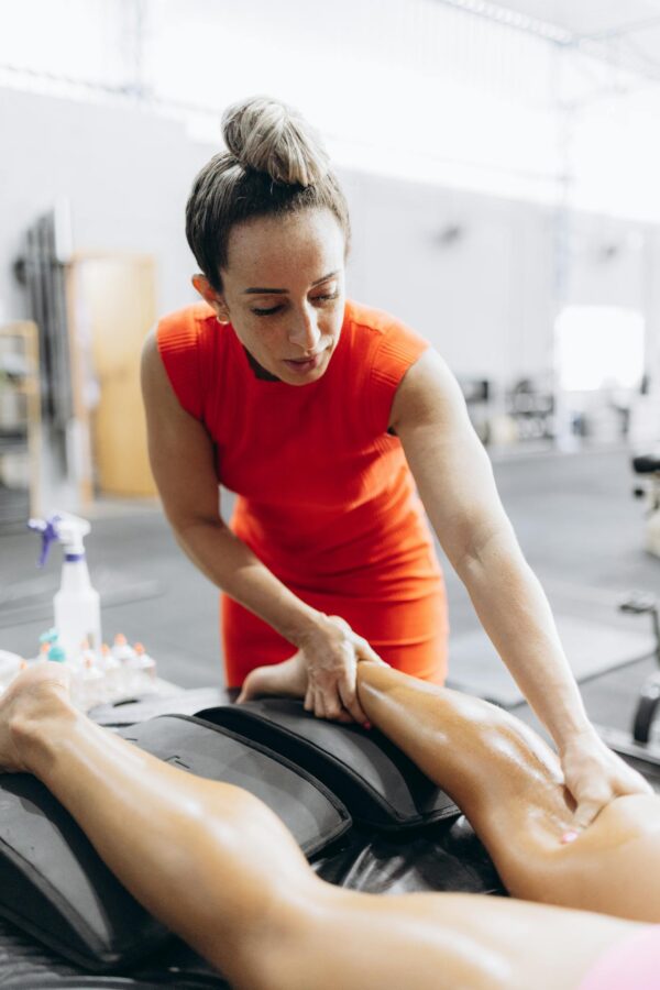 A woman is getting a massage on her leg