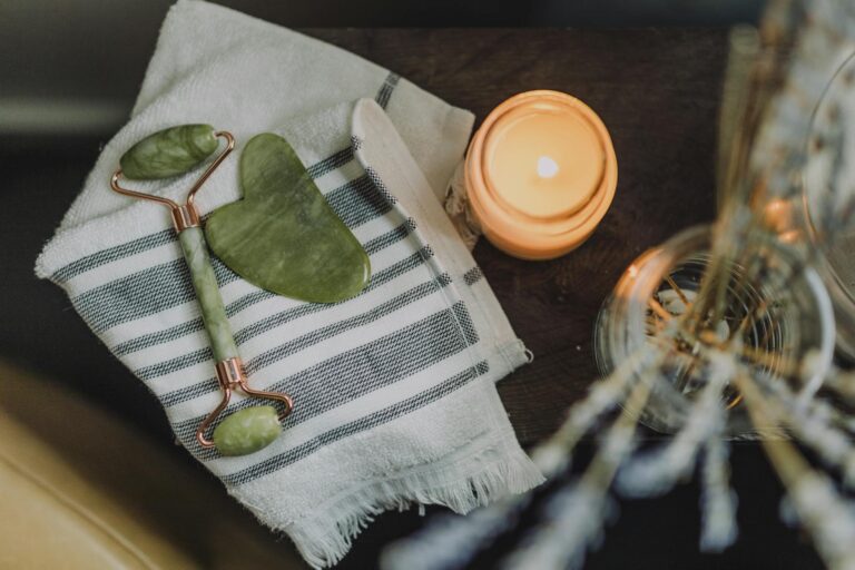 White and Green Textile Beside Orange Plastic Lid